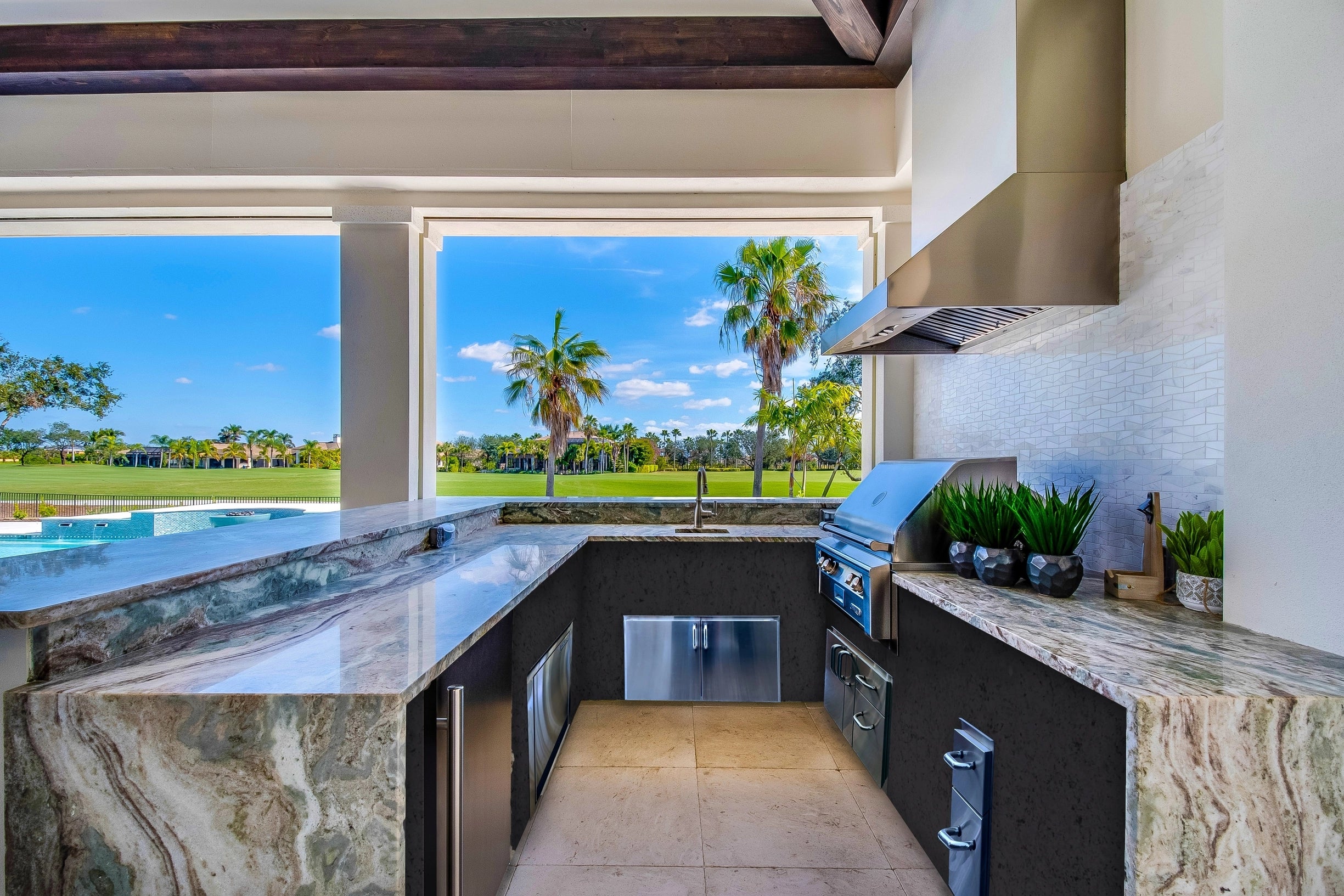 Outdoor kitchen with granite and marble countertops