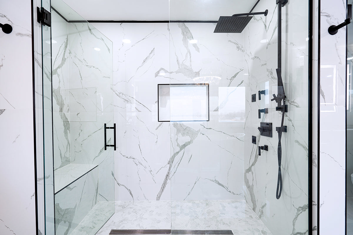 Custom shower installation with stone and glass