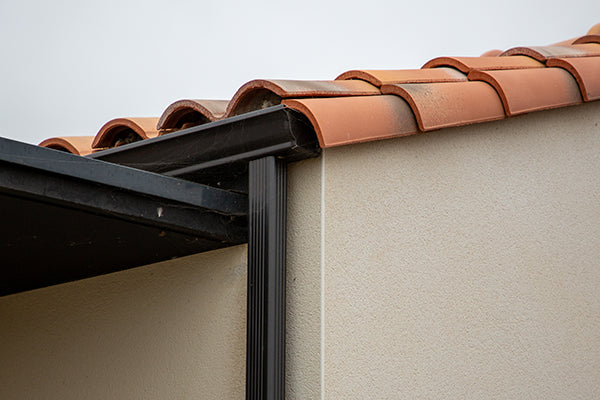 Downspout directing water away from home