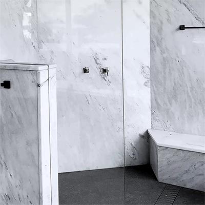 Stone shower walls and floors for luxury
